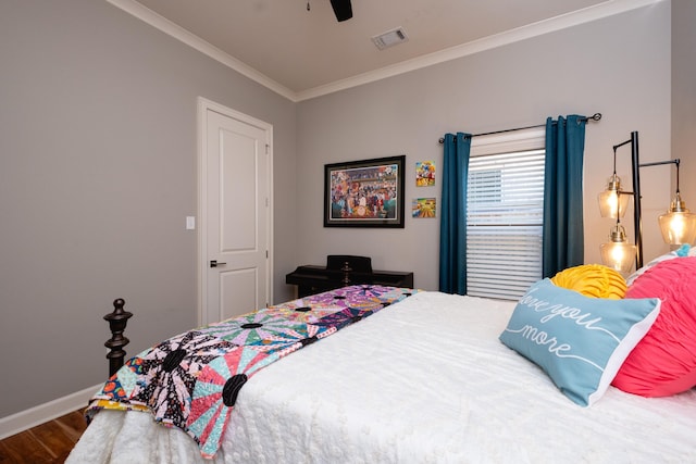 bedroom featuring ceiling fan, wood-type flooring, and ornamental molding