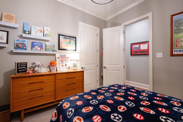 carpeted bedroom with ornamental molding