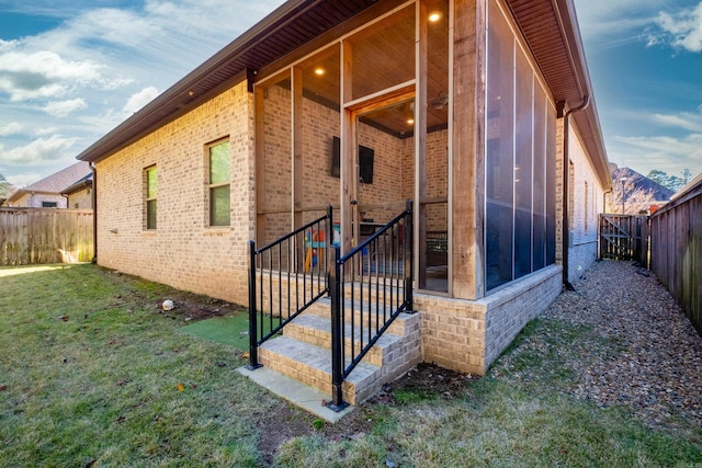 view of home's exterior with a lawn