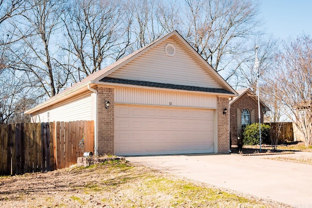 view of side of home with a garage