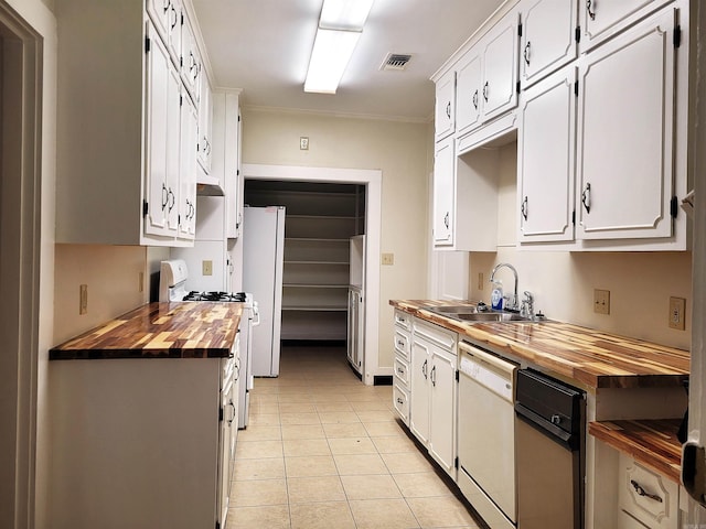 kitchen featuring white cabinets, white appliances, sink, and wooden counters