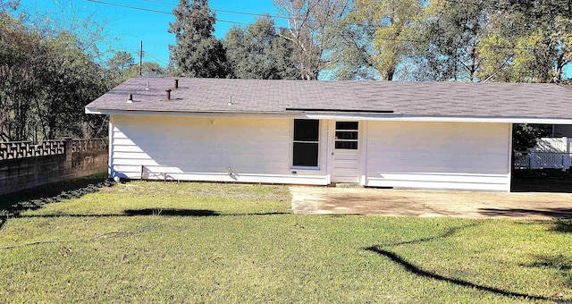 back of house with a yard