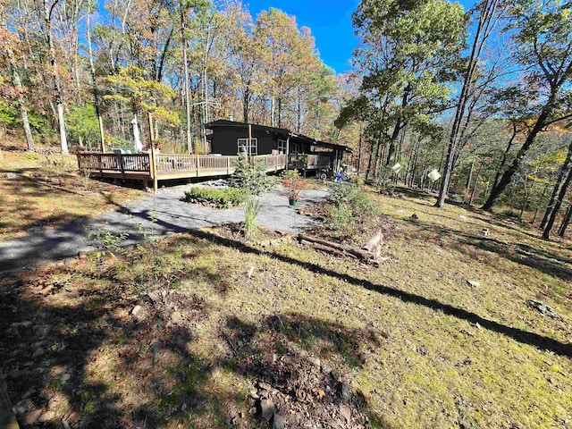 view of yard with a wooden deck