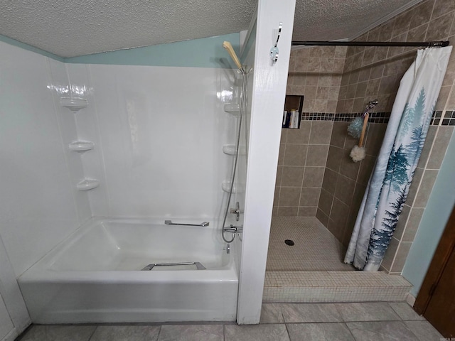 bathroom featuring tile patterned floors and a textured ceiling