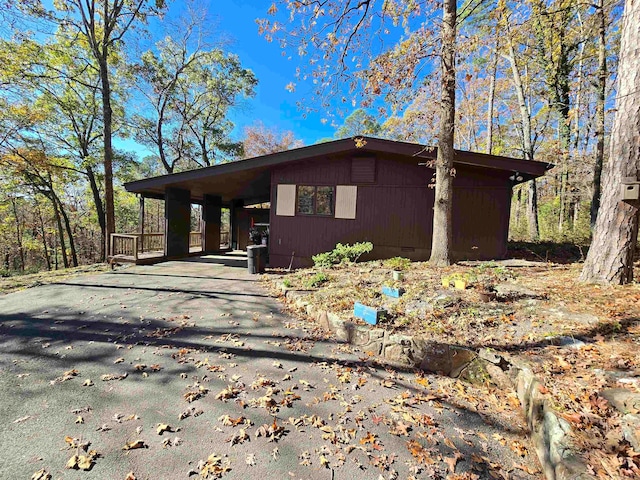 view of home's exterior featuring a carport