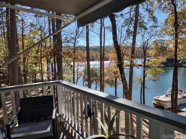 wooden terrace featuring a water view