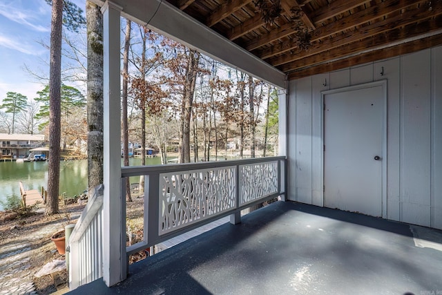 unfurnished sunroom with a water view