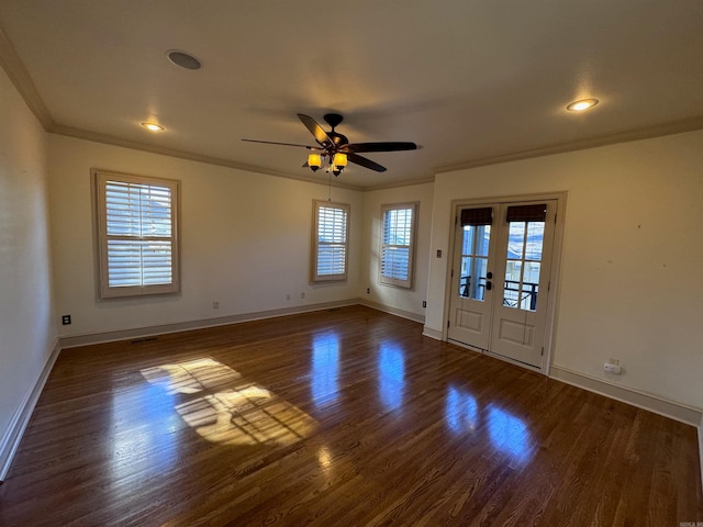 unfurnished room with french doors, dark hardwood / wood-style flooring, ceiling fan, and crown molding