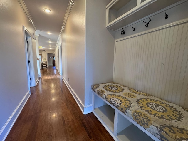 mudroom with dark hardwood / wood-style floors and ornamental molding