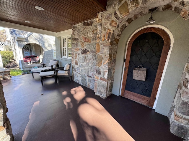 view of patio featuring a porch