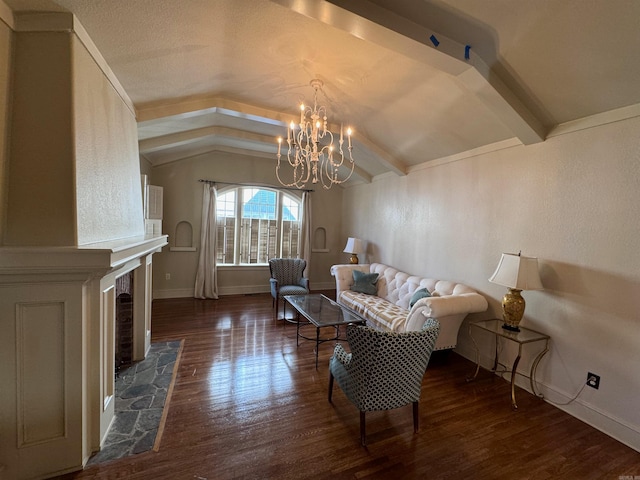 living room with lofted ceiling with beams, a fireplace, dark wood-type flooring, and a notable chandelier