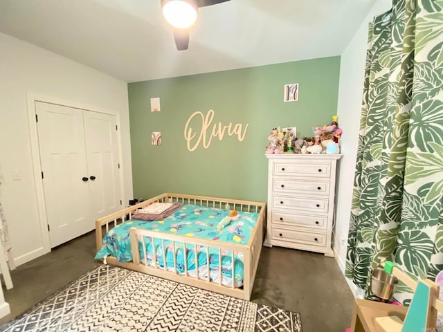 bedroom with ceiling fan and a closet