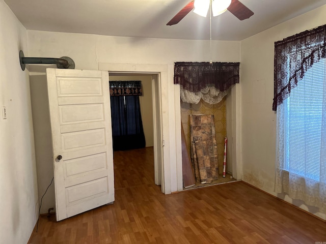 unfurnished bedroom featuring ceiling fan and wood-type flooring