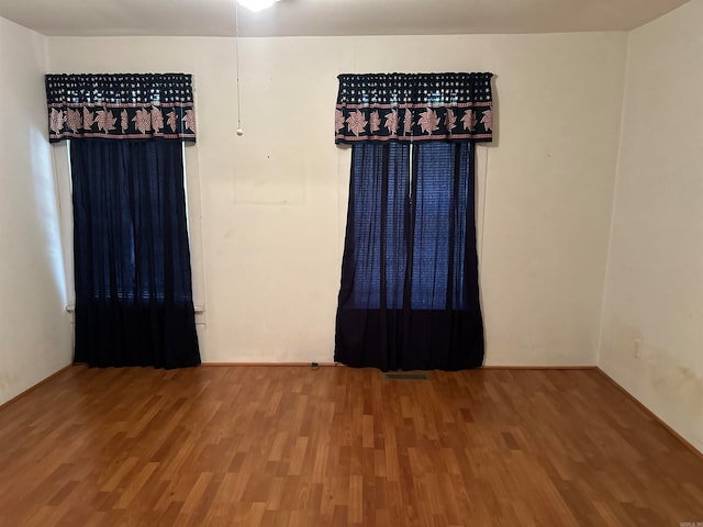 empty room featuring hardwood / wood-style floors