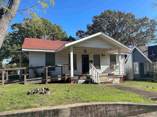 bungalow-style home featuring cooling unit and covered porch