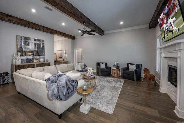 living room featuring beamed ceiling, dark hardwood / wood-style floors, and ceiling fan