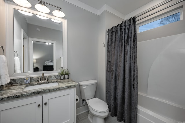 full bathroom featuring vanity, toilet, and shower / bath combo with shower curtain