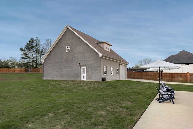 view of property exterior featuring a lawn and central air condition unit