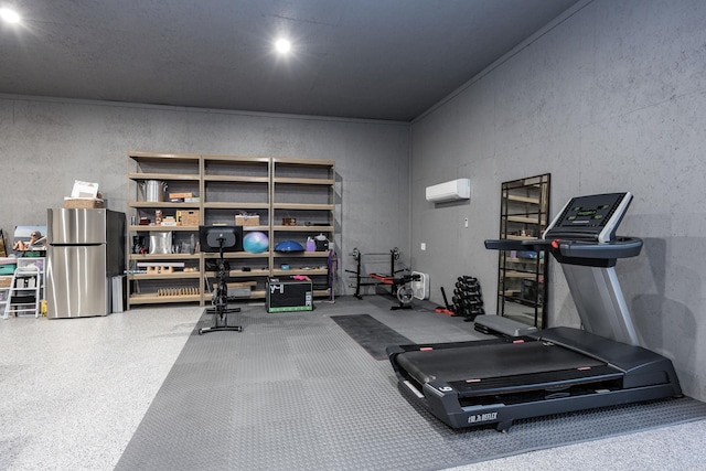 exercise room with an AC wall unit