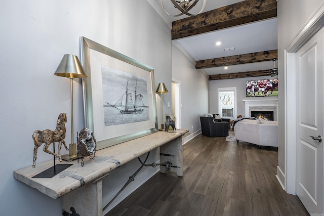 hallway featuring beamed ceiling and dark hardwood / wood-style flooring