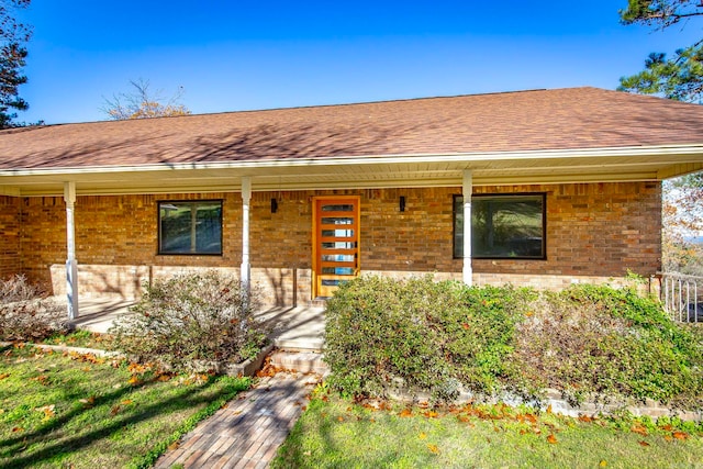 single story home with covered porch