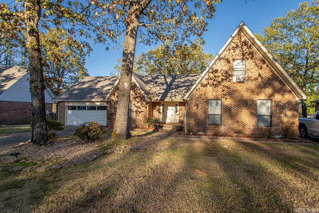 view of front facade featuring a front yard and a garage