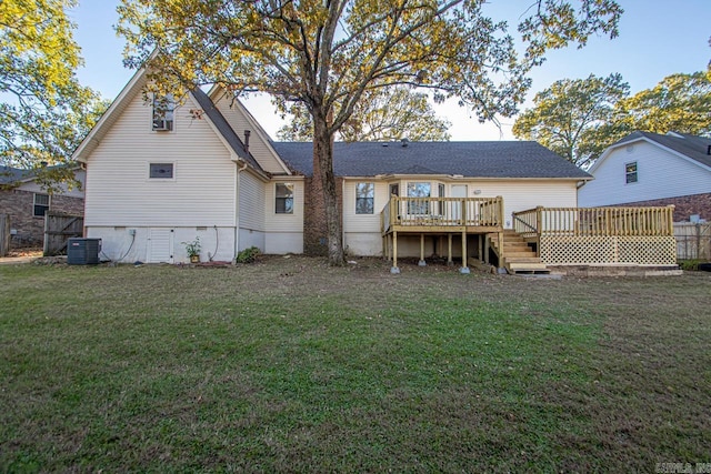 back of house with a lawn, cooling unit, and a wooden deck