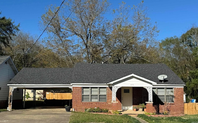 view of front of property featuring a carport