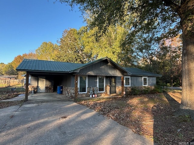 ranch-style home featuring a carport