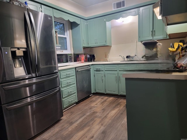 kitchen featuring dark hardwood / wood-style floors and appliances with stainless steel finishes