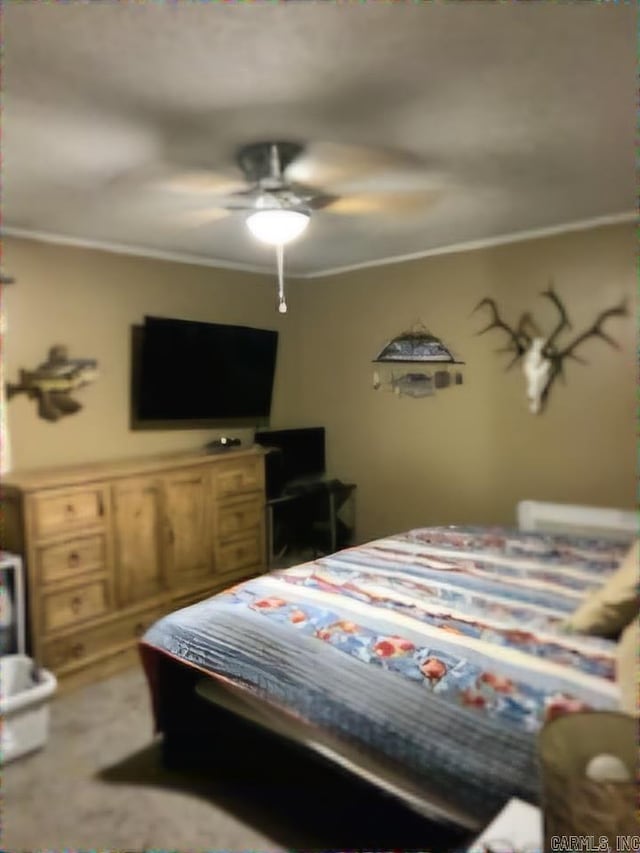 bedroom featuring ceiling fan, ornamental molding, and light carpet