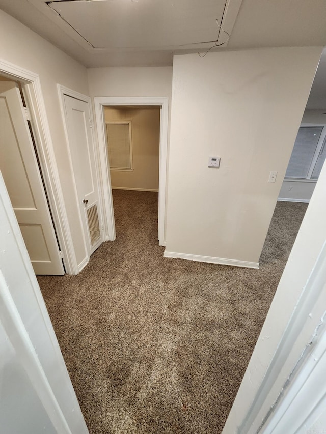 hall with dark carpet