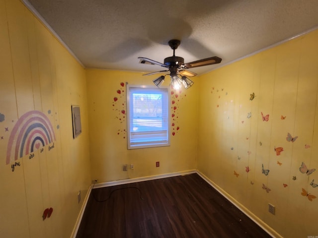 unfurnished room featuring wood-type flooring and a textured ceiling