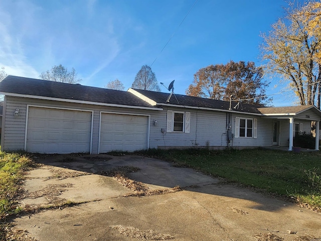 view of property exterior with a yard and a garage