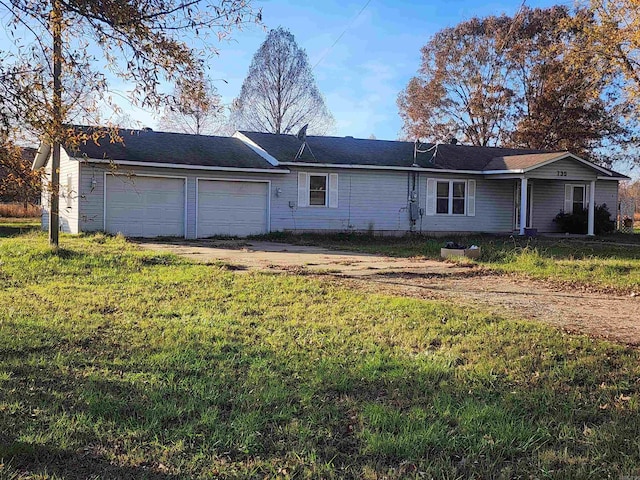 exterior space with a front yard and a garage