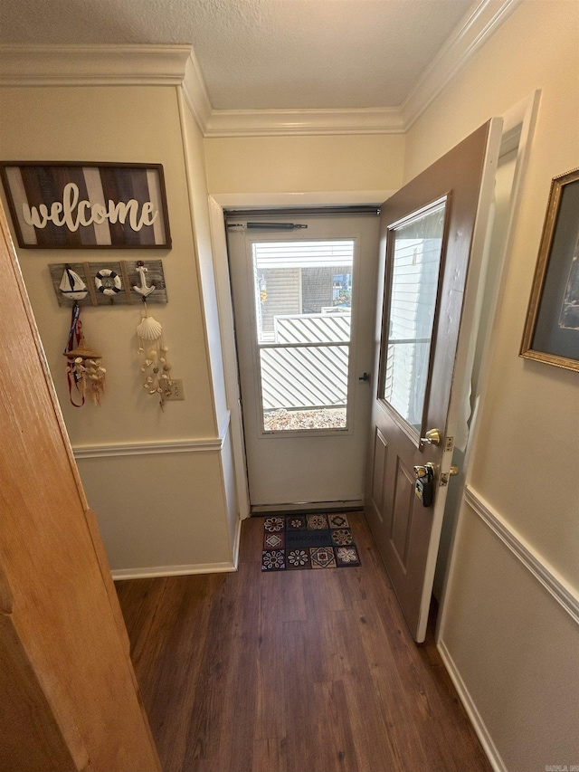 doorway to outside featuring dark hardwood / wood-style flooring and ornamental molding