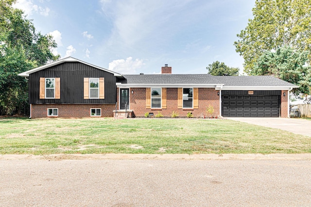 split level home featuring a front lawn and a garage