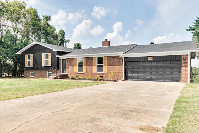 view of front of property with a garage and a front lawn