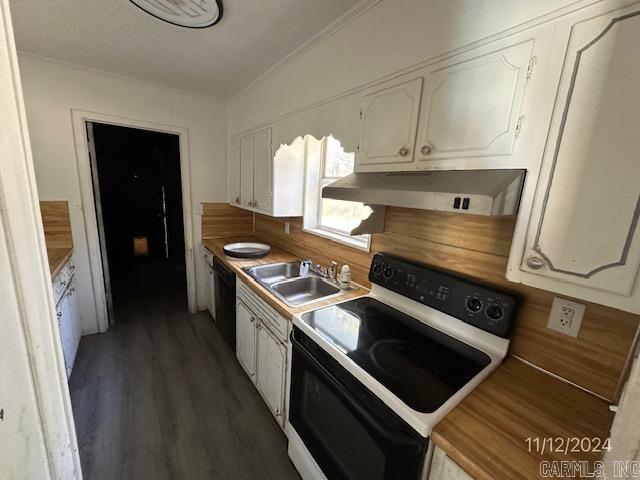 kitchen featuring dark hardwood / wood-style flooring, ventilation hood, white range with electric stovetop, sink, and white cabinetry