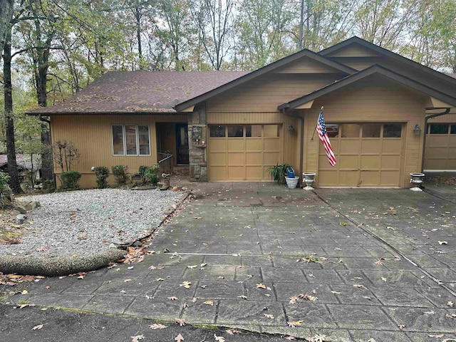 single story home with a garage