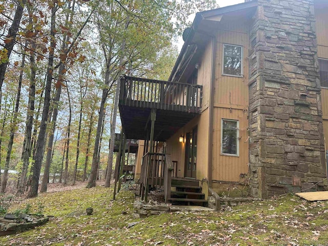 view of side of property featuring a deck