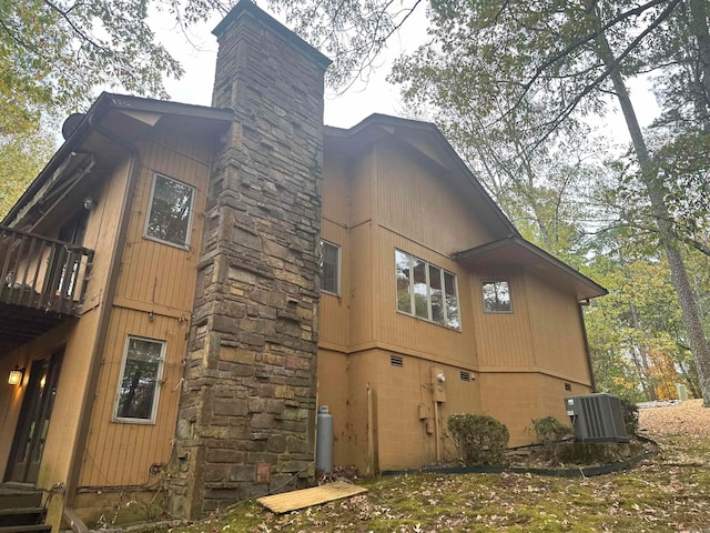 view of home's exterior with central AC