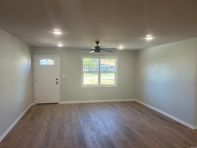 foyer with hardwood / wood-style floors and ceiling fan