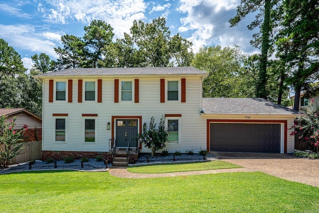 colonial house with a garage and a front yard