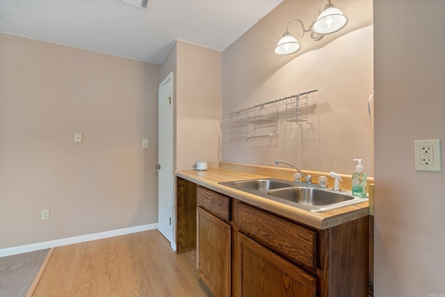 kitchen featuring sink and light hardwood / wood-style floors