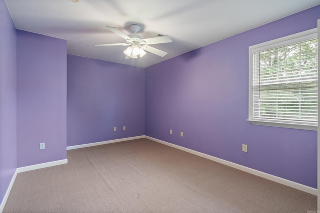 empty room with carpet flooring and ceiling fan