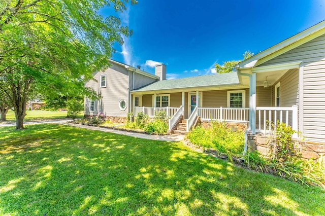 view of front of home with a front lawn and covered porch