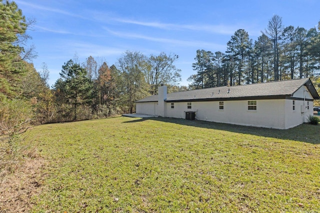 exterior space featuring a lawn and cooling unit