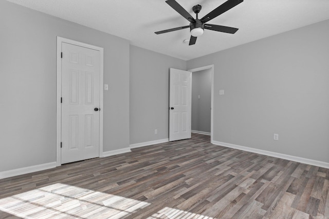 interior space featuring dark hardwood / wood-style floors and ceiling fan