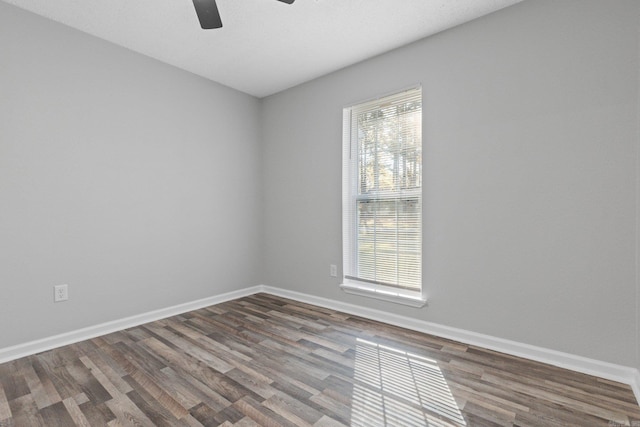 empty room with hardwood / wood-style flooring and ceiling fan